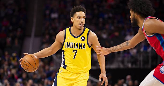 Indiana Pacers guard Malcolm Brogdon (7) gets defended by Detroit Pistons forward Marvin Bagley III (35) during the second quarter at Little Caesars Arena.